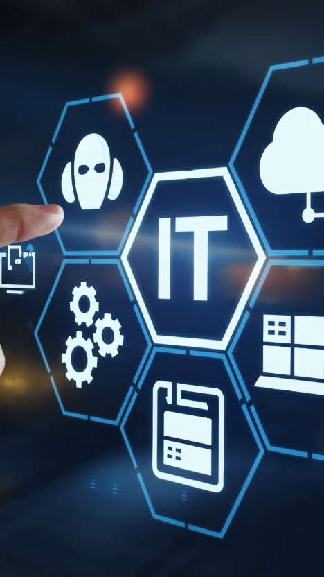 「IT」を中心に、AI、クラウド、ネットワーク、設定などのアイコンが並ぶデジタルインターフェースを指で操作しているイメージ画像。